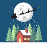 Santa Claus And His Reindeer Sleigh In Silhouette Against Moon W Stock Photo