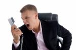 Angry Employee Shouting On Phone Stock Photo
