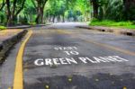 Words Of Start To Green Planet On The Road Surface Stock Photo