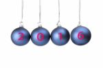 Four Blue Christmas Baubles Symbolizing New Year 2016 Stock Photo
