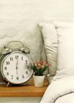 Alarm Clock In Bedroom Stock Photo