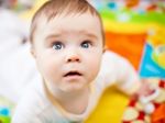 Infant Boy On Playmat Stock Photo