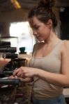 Brunette In Kitchen With Coffee Maker Stock Photo