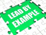 Lead By Example Puzzle Shows Leading Leadership And Motivation Stock Photo