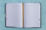 Notebook On Blue Background Stock Photo