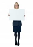 Businesswoman Holding blank board Stock Photo