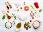 The Ingredients For Homemade Pizza On White Wooden Background Stock Photo