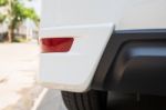 Closeup Of A Taillight On A Modern White Car. Reflection Light Stock Photo