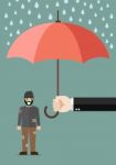 Hand Holding An Umbrella Protecting Poor Man Stock Photo
