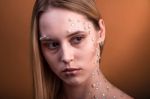 Girl With White And Pearl Rhinestones On Her Face Stock Photo
