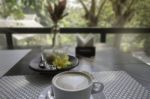 Hot Coffee Latte On Balcony Wooden Table Stock Photo