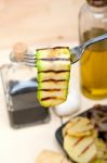 Grilled Zucchini Courgette On A Fork Stock Photo