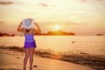 Visitors Woman Looking The Sunrise Over The Sea Stock Photo