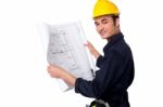 Construction Worker Reviewing Blueprint Stock Photo