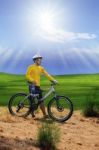 Young Man Standing Beside Moutain Bike ,mtb On Hill With Sun Shi Stock Photo