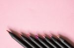 Pink Tone Colour Black Pencils On Pastel Pink Background Stock Photo