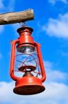 Old Red Lantern On Blue Sky Stock Photo