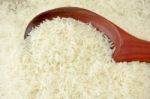 Rice With Wooden Ladle Stock Photo