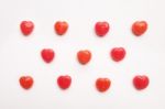 Red Valentine's Day Heart Shape Candy Pattern On Empty White Paper Background. Love Concept. Colorful Hipster Style. Knolling Top View Stock Photo