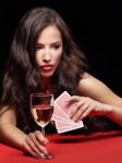 Woman Holding Gambling Cards And Wine Stock Photo