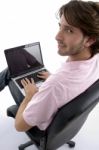 Side View Of Man With Laptop Stock Photo
