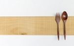 Wooden Fork And Spoon On Wooden Sign Stock Photo
