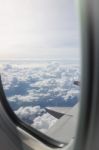 Cloudy Sky View From Airplane Cabin Window Stock Photo