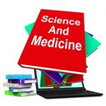 Science And Medicine Book Stack Laptop Shows Medical Research Stock Photo