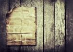 Old Paper On Wood Background Stock Photo