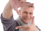 Young Male Showing Directing Hand Gesture Stock Photo