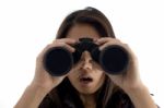 Astonished Female Watching Through Binocular Stock Photo