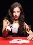 Woman Gambling On Red Table Stock Photo
