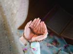 Hands Of Young Muslim Woman Praying For  God Stock Photo