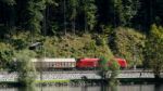 Cargo Train Running Along The Edge Of Lake Hallsattt Stock Photo