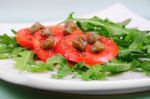 Salad With Fresh Tomatoes, Capers And Arugula Stock Photo