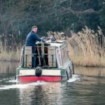 Narrow Boat On The River Wey Navigations Canal Stock Photo