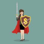 Business Woman With Shield And Sword Stock Photo