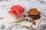 Raw Minced Meat With Bread And Rosemary Stock Photo