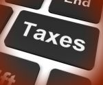 Taxes Key Shows  Tax Or Taxation Stock Photo