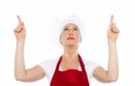 Female Chef Pointing Upwards Stock Photo