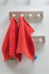 Red Towel Hangs In A Bathroom Stock Photo