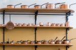 Shelves Full With Copper Saucepans Stock Photo