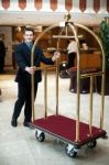 A Concierge Pushing The Cart Stock Photo