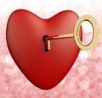 Heart With Key On Bokeh Background Stock Photo