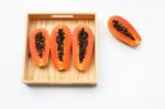 Papaya In Wooden Box On White Background Stock Photo