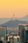 View Of Seoul Tower And Cityscape With Golden Light In Seoul, South Korea Stock Photo