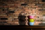Colorful Tiffin Carrier On Wooden Cupboard Stock Photo