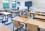 Empty Classroom With Tables And Chairs Stock Photo