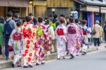 Tourists Wearing Japanese Traditional Kimono Walking In Arashiyama,kyoto In Japan Stock Photo