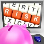 Risk Keys On Monitor Showing Investment Risks Stock Photo